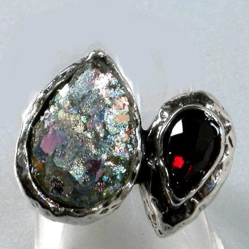 Choose this amazing Sterling silver ring with Roman Glass and a faceted garnet.