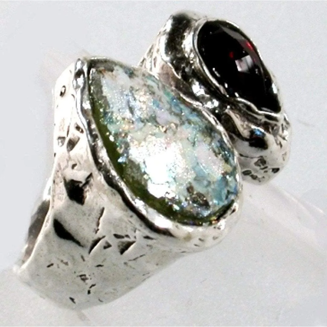 Choose this amazing Sterling silver ring with Roman Glass and a faceted garnet.